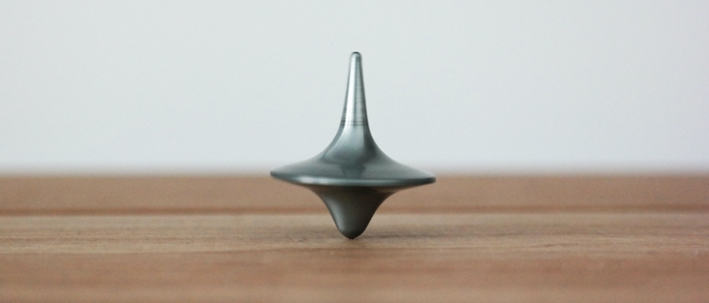 top symbolizing mix balance